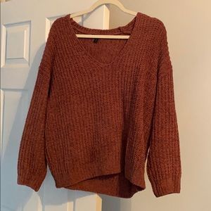 Dark pink knitted sweater with v neck
